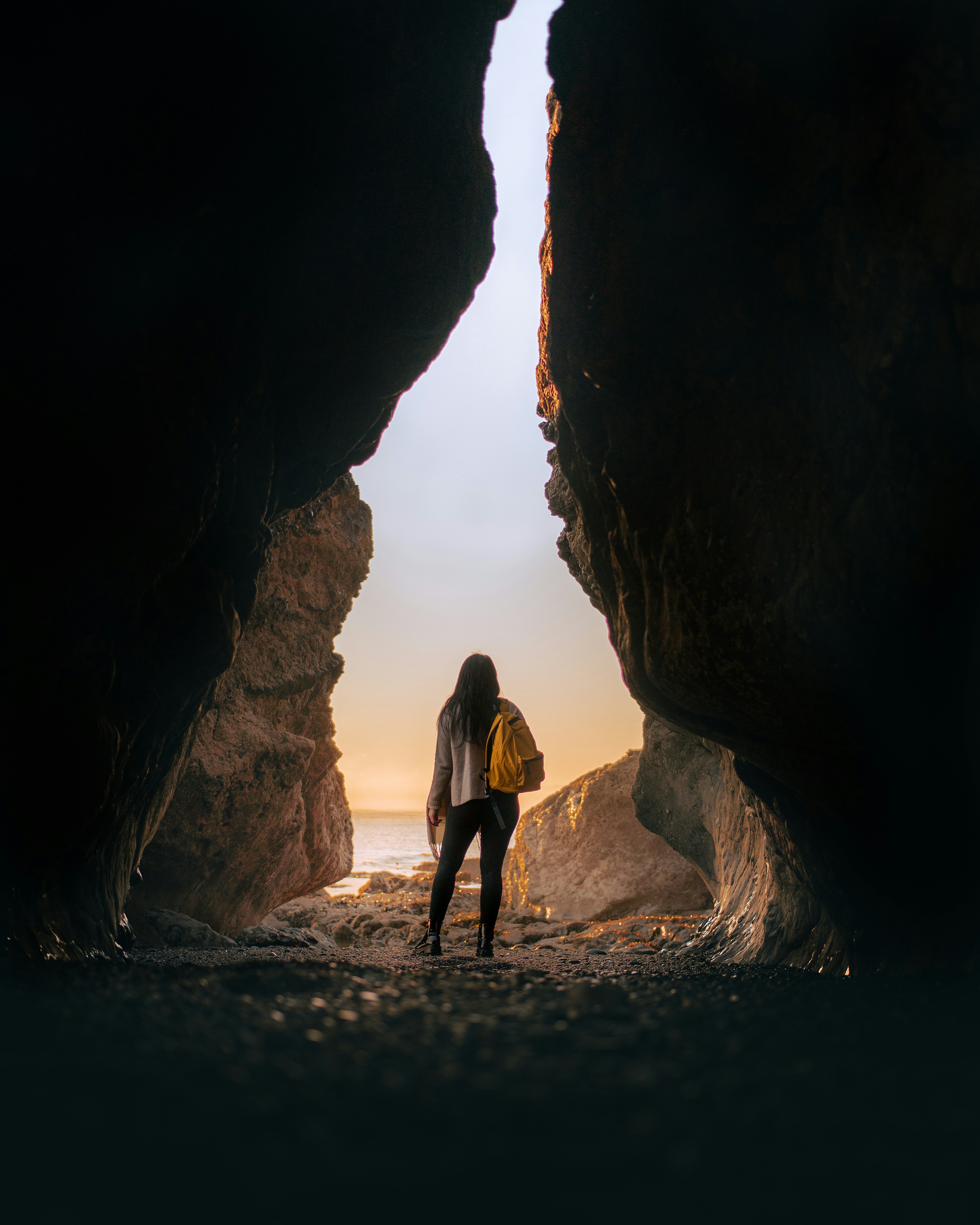 Woman standing alone in a cenote in Mexico